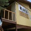 Framing in porch railing and then siding adds addional wing to the house